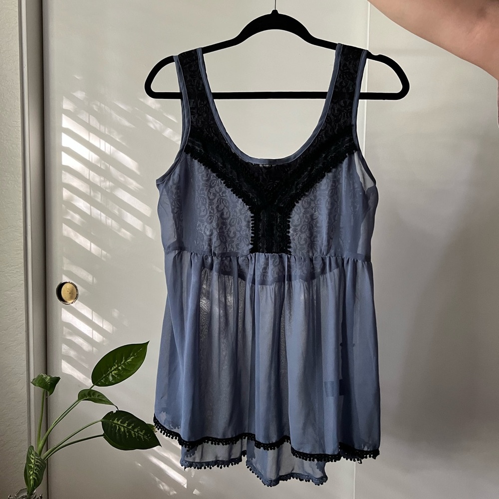 Sheer blue blouse with lace trimming